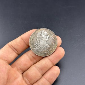 Spanish 8 Reales silver coin from 1776, featuring King Charles III