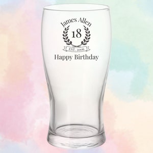 May include: Clear glass beer mug with a personalised inscription that reads "James Allen 18 EST. 2006 Happy Birthday".