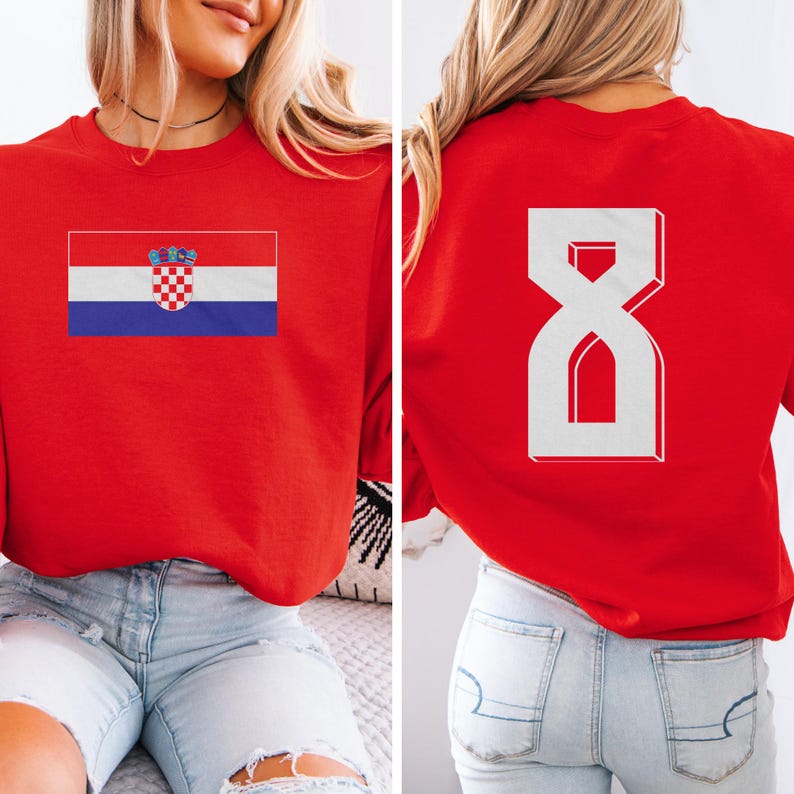 A woman wearing a red shirt with the Croatia national flag and the number 8 on the back.
