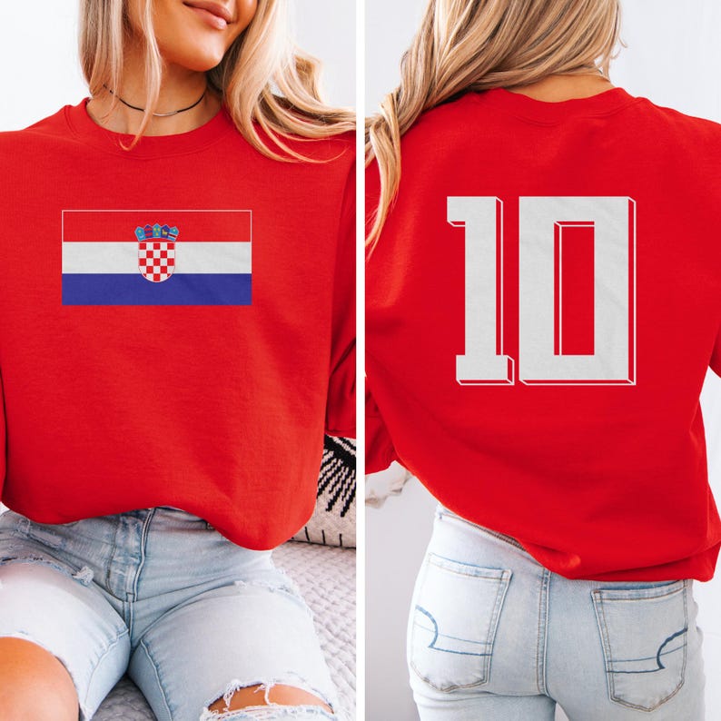 A woman wearing a red sweatshirt with the Croatia national flag and the number 10 on the back.
