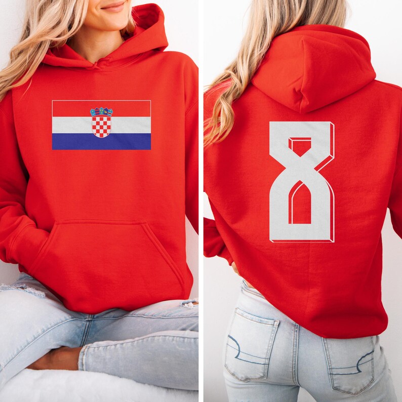 A woman wearing a red hoodie with the Croatia national flag printed on it.