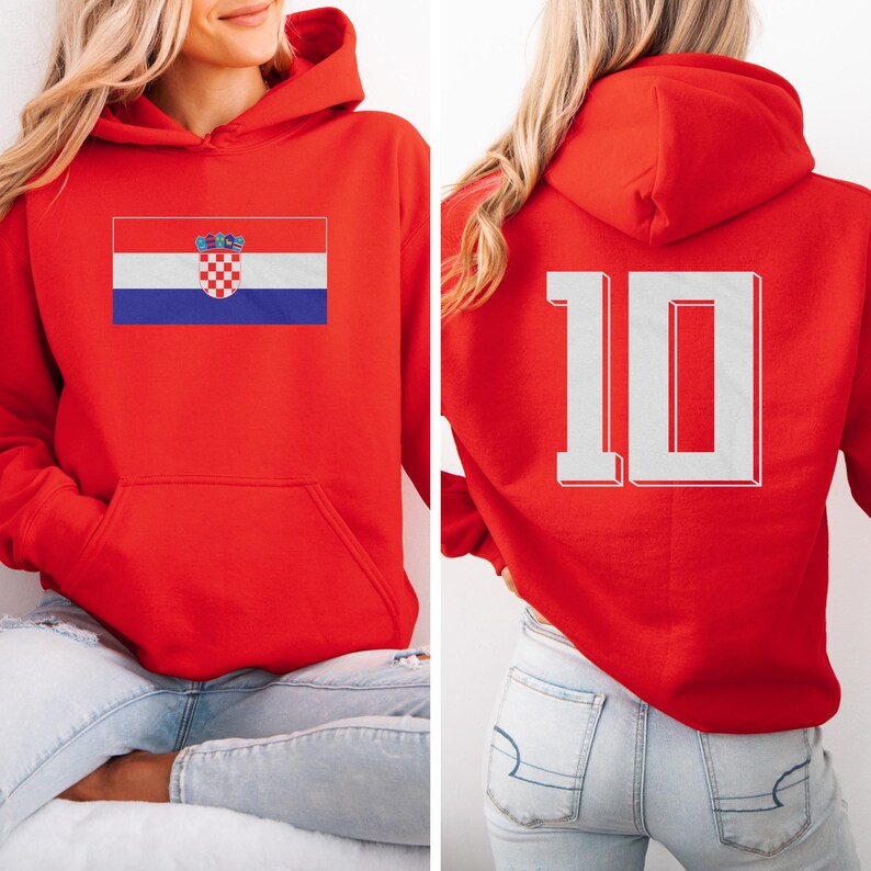 A woman wearing a red hoodie with the Croatia national flag and the number 10 on the back.