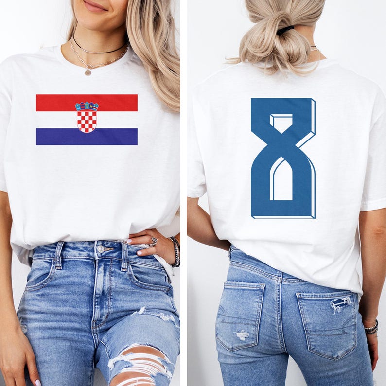 A woman wearing a white t-shirt with the Croatia national flag and the number 8 on the back, along with distressed blue jeans.