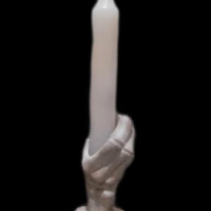 handcrafted skeleton hand candle holder