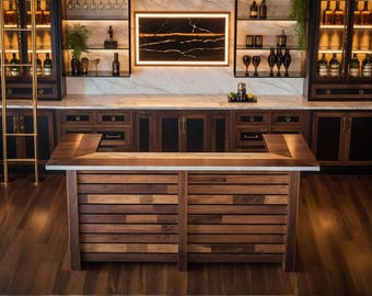 May include: A bespoke home bar with a wooden bar and cabinetry. The bar has a multi-level design with a wooden front and a marble countertop. The cabinetry includes glass-fronted cabinets and drawers, with a gold-coloured ladder for access to the upper shelves.