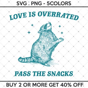 May include: A teal blue raccoon with a white chest and a black tail is standing on its hind legs with its paws raised. The raccoon is looking up at the stars. The text "LOVE IS OVERRATED" is above the raccoon and the text "PASS THE SNACKS" is below the raccoon. The text "BUY 2 OR MORE GET 40% OFF" is at the bottom of the image.