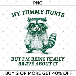 Op de afbeelding: Een cartoonwasbeer met een zonnebril met de tekst "MY TUMMY HURTS BUT I'M BEING REALLY BRAVE ABOUT IT" en "BUY 2 OR MORE GET 40% OFF" onder de wasbeer.