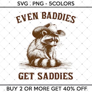 May include: A black and white illustration of a raccoon wearing a cowboy hat. The raccoon is sitting on a wooden surface. The text "EVEN BADDIES GET SADDIES" is written below the raccoon. The text "BUY 2 OR MORE GET 40% OFF" is written below the text.
