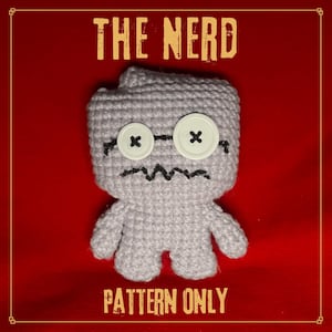 May include: A crocheted gray doll with button eyes and a stitched mouth, resembling a nerdy character. The text "THE NERD" is above the doll, and "PATTERN ONLY" is below it, all against a red background.