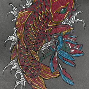 May include: A detailed, colorful rhinestone design of a koi fish with a flower. The fish is primarily red with yellow and black accents, and the flower is blue and green. The design is set against a dark gray background.