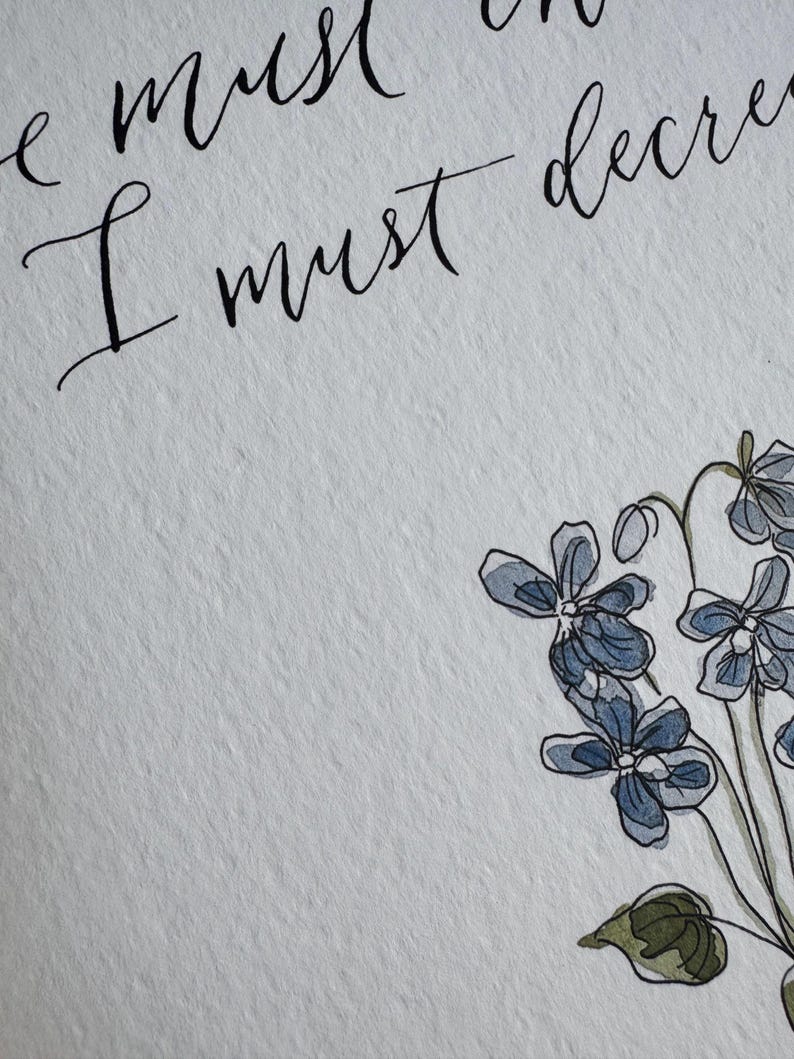 May include: A white textured paper print featuring black calligraphy text that reads "he must increase, I must decrease" positioned above a watercolor illustration of blue and purple flowers with green leaves and thin dark stems.