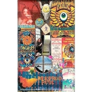 May include: A light switch cover with a collage of images and text related to the band "Spread Panic". The cover features a psychedelic design with images of eyes, wings, and a concert poster. The text on the cover includes the band's name, "Spread Panic", and the phrase "Panic in the Streets".