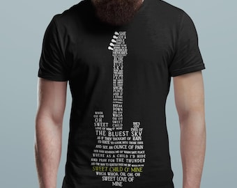 May include: A black short-sleeved t-shirt featuring a white graphic shaped like an electric guitar. The graphic is composed of lyrics from the song Sweet Child O' Mine, with the title text printed in yellow at the bottom of the guitar shape.