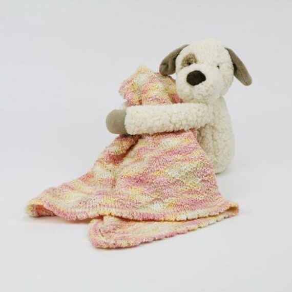 pink and white stuffed puppy