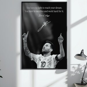 May include: Black and white framed print featuring Lionel Messi, with the text "You have to fight to reach your dream. You have to sacrifice and work hard for it." Messi is wearing a soccer jersey with the number 10.