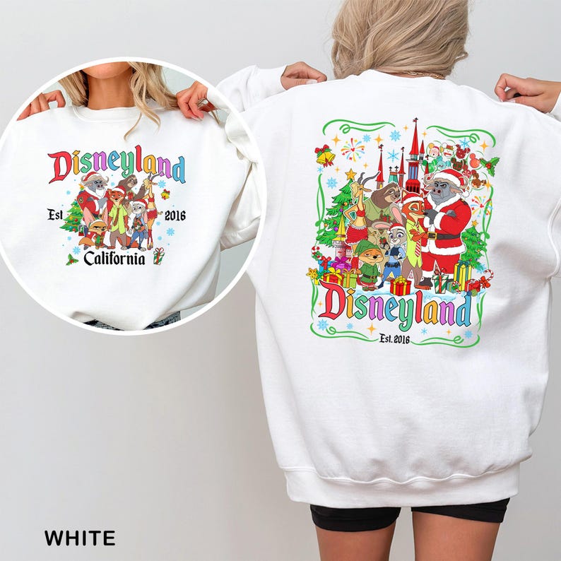May include: White sweatshirt with a Disneyland graphic on the front and back. The front graphic says "Disneyland Est. 2016 California" with cartoon characters. The back graphic has a similar design with a castle and more characters.