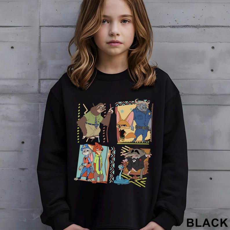 May include: Black sweatshirt featuring a colorful graphic of characters from the animated movie Zootopia. The design includes four square panels with different characters. The word "BLACK" is printed in white at the bottom right.