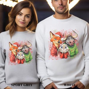 May include: Sport grey and white sweatshirts featuring a colorful graphic of cartoon characters wearing Santa hats and sweaters. The image includes the text "SPORT GREY" and "WHITE" at the bottom.
