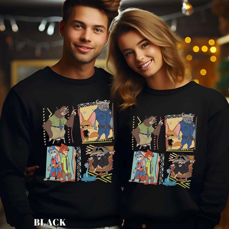 May include: Black sweatshirt featuring a colorful cartoon design with animal characters. The design includes a sloth, fox, and a police officer. The word "BLACK" is printed at the bottom of the sweatshirt.