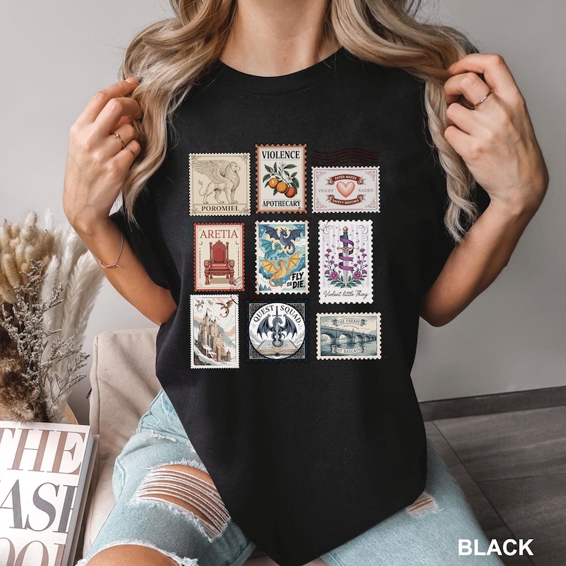 May include: Black t-shirt featuring a collection of postage stamp designs. The stamps showcase various illustrations, including a griffin, a throne, a dragon, and a bridge. The word "BLACK" is printed at the bottom right.