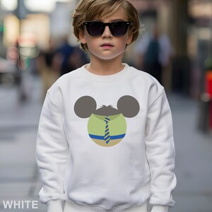 May include: White sweatshirt featuring a cartoon design of a mouse head with a green shirt and blue tie. The mouse head has gray ears and a green shirt with a blue and yellow striped tie. The word "WHITE" is at the bottom of the image.