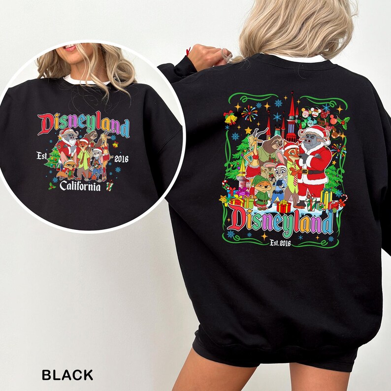 May include: Black sweatshirt with a Disneyland graphic. The design features various Disney characters in festive attire, with the text "Disneyland Est. 2016 California". The sweatshirt has a crew neck and long sleeves.