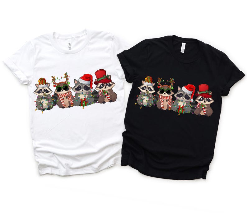 May include: Five raccoons wearing Santa hats and Christmas lights, with one wearing a top hat. The raccoons are on a white and black t-shirt.