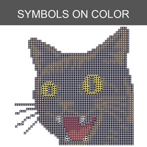 May include: A cross-stitch pattern chart of a cat head featuring the text SYMBOLS ON COLOR at the top. The design uses a grid of squares filled with various symbols like circles, triangles, and hearts to represent colors for the cat's fur, yellow eyes, and pink mouth.
