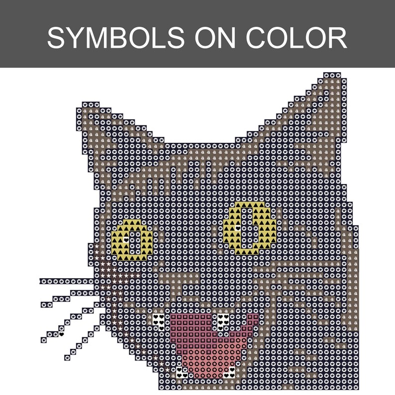 May include: A cross-stitch pattern chart of a cat head featuring the text SYMBOLS ON COLOR at the top. The design uses a grid of squares filled with various symbols like circles, triangles, and hearts to represent colors for the cat's fur, yellow eyes, and pink mouth.