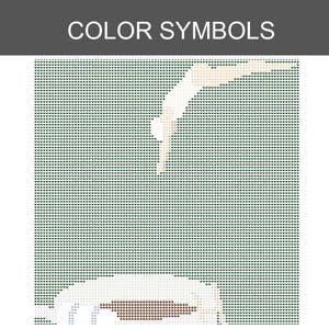 Puede incluir: Un patr&oacute;n de punto de cruz pixelado titulado COLOR SYMBOLS que muestra una figura sumergi&eacute;ndose en una taza de caf&eacute;. El dise&ntilde;o utiliza una cuadr&iacute;cula de peque&ntilde;os corazones en tonos verde oscuro, beige y marr&oacute;n para formar la imagen.
