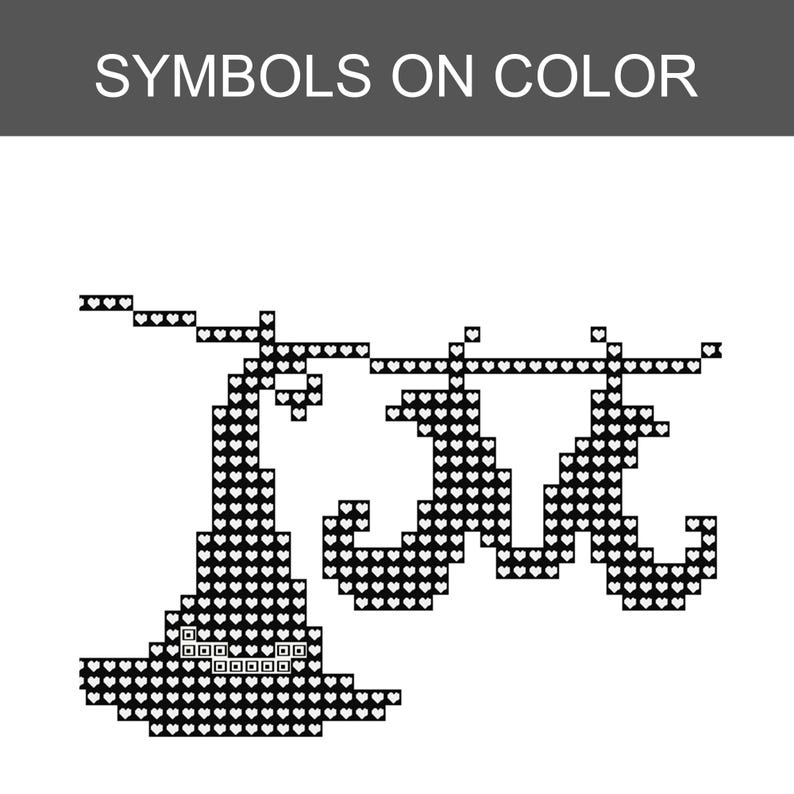 May include: A cross-stitch pattern titled SYMBOLS ON COLOR featuring a black pixelated design of a pointed hat and a moustache shape. The graphic is composed of small heart-shaped symbols arranged in a grid to form the distinct shapes on a white background.