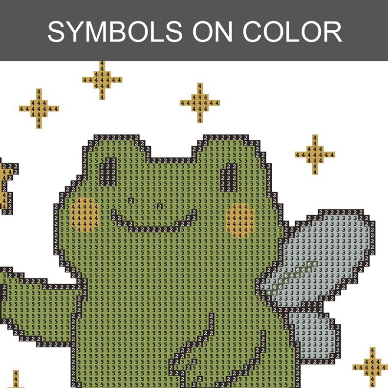 May include: A pixelated image with the text "SYMBOLS ON COLOR" at the top. The image features a green frog-like creature with a white belly and several gold star-shaped symbols. The design is made up of small squares.