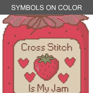 Peut inclure: Un diagramme de point de croix repr&eacute;sentant un pot de confiture de fraises. Le motif comprend une fraise centrale, quatre petits c&oelig;urs et le texte "Cross Stitch Is My Jam" sur une &eacute;tiquette cr&egrave;me sur un fond rouge vif.