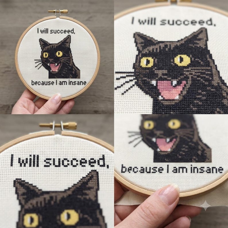 May include: A circular wooden embroidery hoop containing white fabric with a cross-stitch design of a black cat with yellow eyes and an open mouth. The black text above the cat reads I will succeed, and below the cat reads because I am insane.