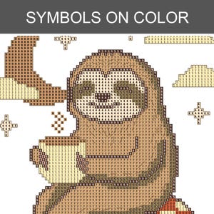 May include: A diamond painting pattern featuring a sloth holding a mug, with the text SYMBOLS ON COLOR at the top. The design includes a crescent moon, stars, and clouds, all composed of a grid of squares filled with numbers and letters for color coding.