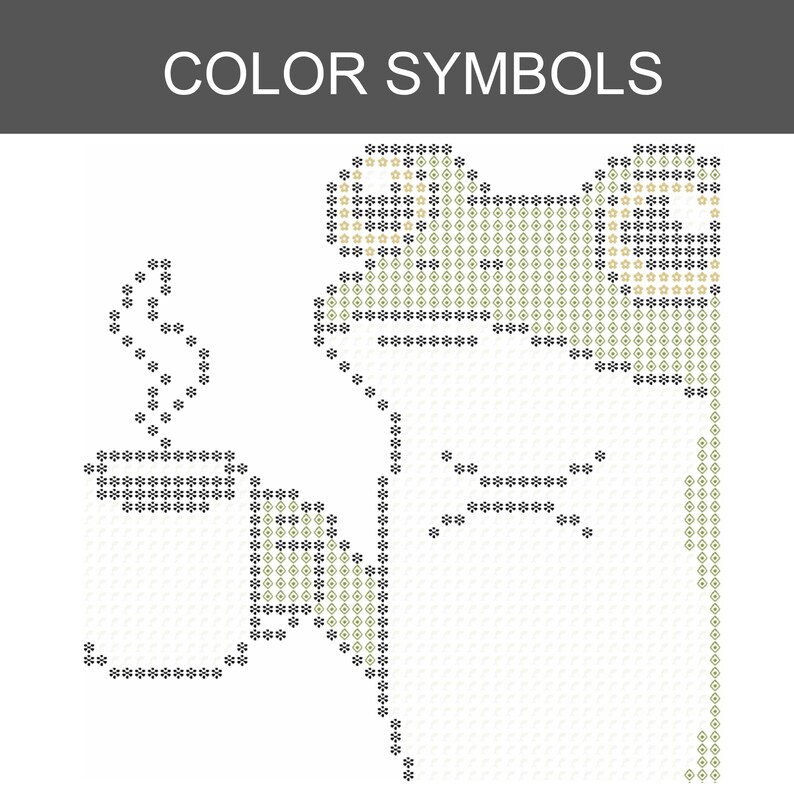 Puede incluir: Un patr&oacute;n de punto de cruz titulado COLOR SYMBOLS que presenta un dise&ntilde;o en cuadr&iacute;cula de una rana sosteniendo una taza humeante. El patr&oacute;n utiliza s&iacute;mbolos negros y verde oliva para delinear la cabeza, el cuerpo y la taza sobre un fondo blanco.