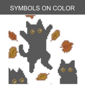 May include: A cross-stitch pattern titled SYMBOLS ON COLOR featuring a central black cat jumping, a smaller cat head at the bottom right, a partial cat head at the bottom left, and several orange and yellow autumn leaves scattered around.