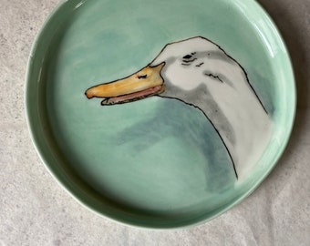 Laughing duck - a porcelain plate