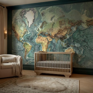 May include: A nursery with a large, detailed world map mural in shades of green, brown, and blue. A light wood crib and a beige armchair with a throw blanket are in the room. A rug and a dresser complete the decor.