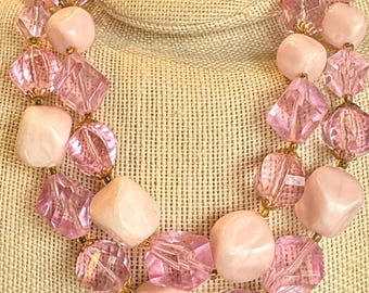 A Vintage Double Strand Bead Necklace with Pink Faceted Plastic Beads And Smooth Ivory Plastic Beads from West Germany