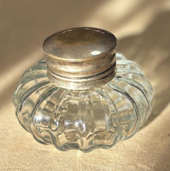 An Antique Soda-Lime Pressed Clear Glass Ink Well with a Metal Hinged Lid