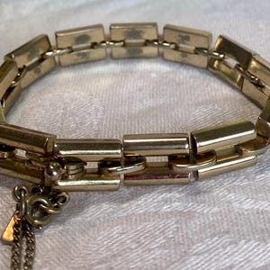 A Vintage Monet Gold Tone Chain Link Bracelet with Safety Chain