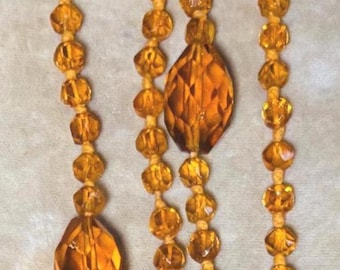 An Antique Flapper Art Deco Necklace With Golden Amber Glass Beads
