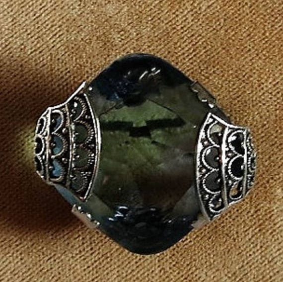A Costume Cocktail Ring with a Cut Blue Glass Sto… - image 1