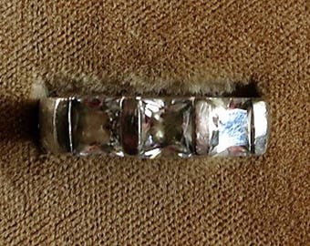 A Sterling Silver RIng with Channel Set Faceted Rhinestones, Size 7