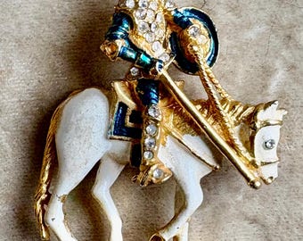 A Vintage Brooch Featuring Don Quixote on his White Horse
