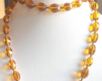 An Antique Art Deco Necklace of Hand Knotted Amber Glass Beads...Circa 1920's