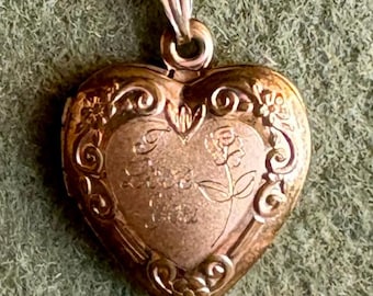 A Vintage Gold Filled Heart Locket with the Words: "I Love You"  Engraved on the Front