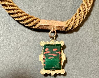 A Necklace Made With A Victorian Braided Hair Mourning Watch Fob Connected to a Watch Chain
