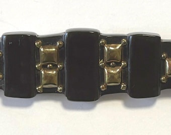 An Antique Black Bakelite Brooch with Brass Metal Accents